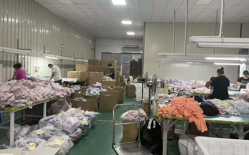Swimwear packing and QC floor at YucaiFJ - every low-MOQ order passes AQL 2.5 inspection before shipping