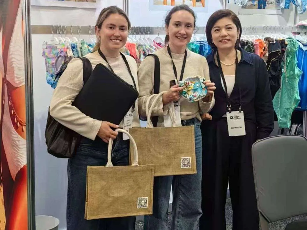 YucaiFJ team with clients at expo